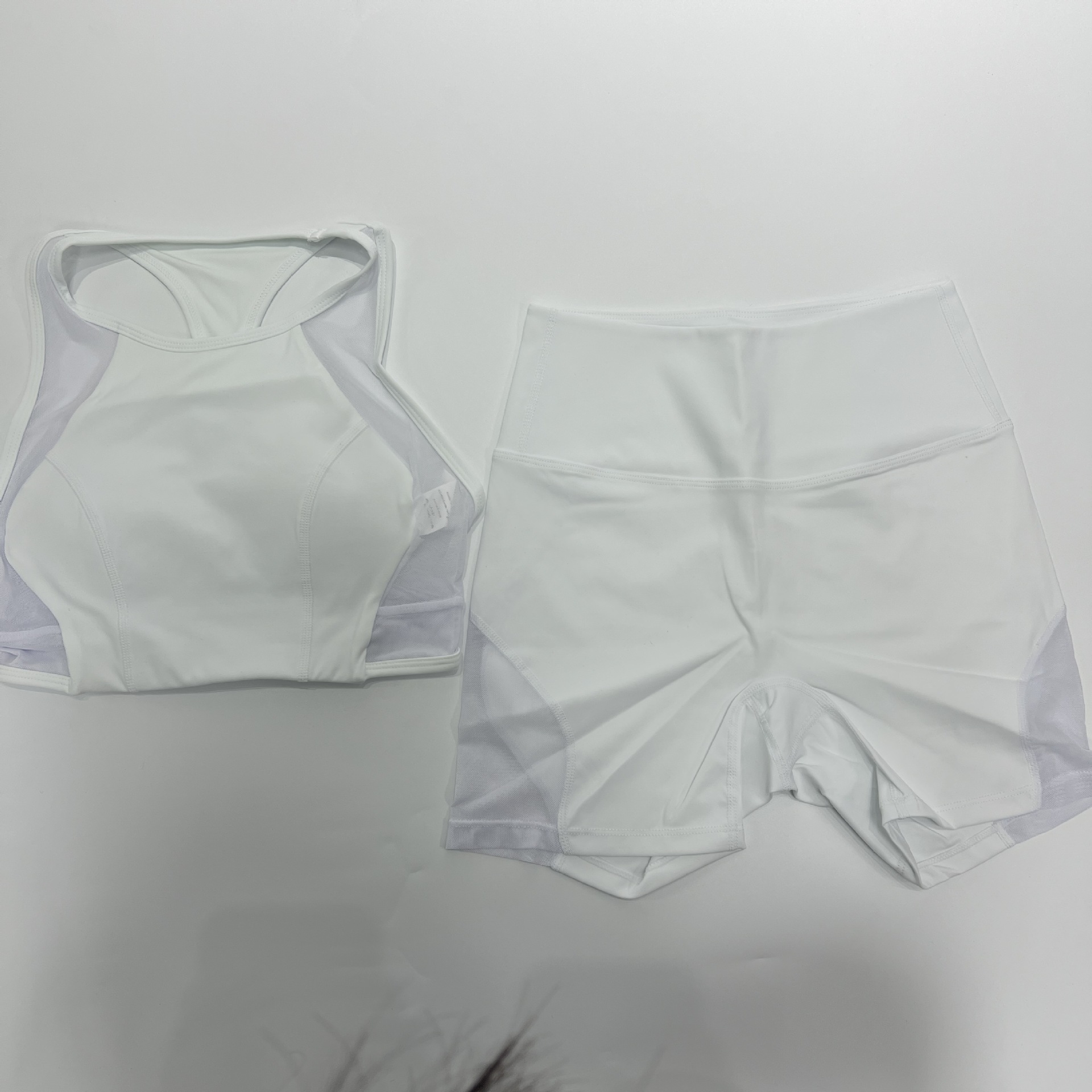 Conjuntos de sujetador deportivo de malla con leggings ajustados para levantar la cadera, pantalones deportivos de fitness y yoga para mujer FGB25126