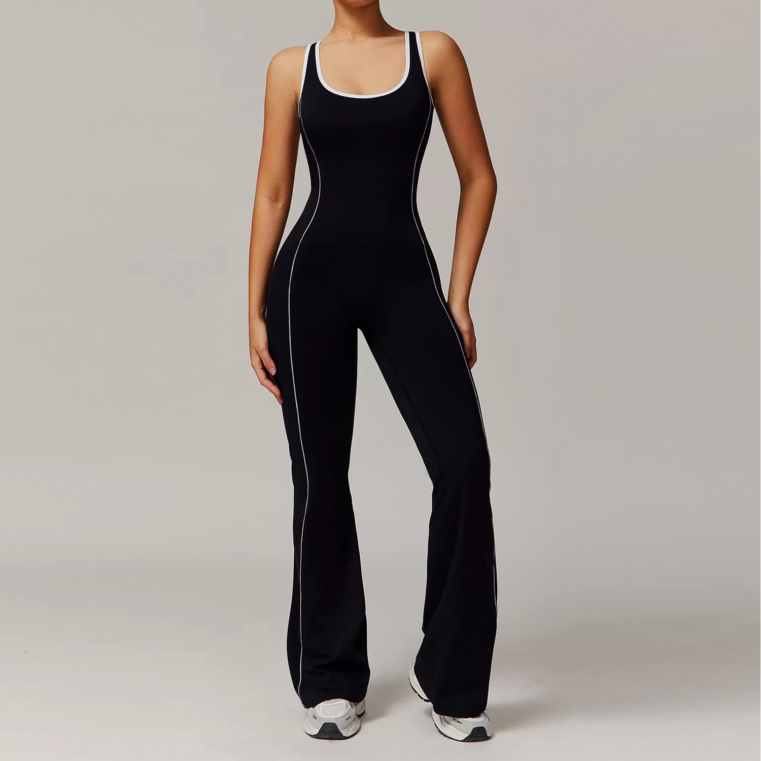 Traje de yoga ajustado al por mayor, mono de una pieza con dobladillo acampanado y control de abdomen para realce de glúteos, FGBDLT5009