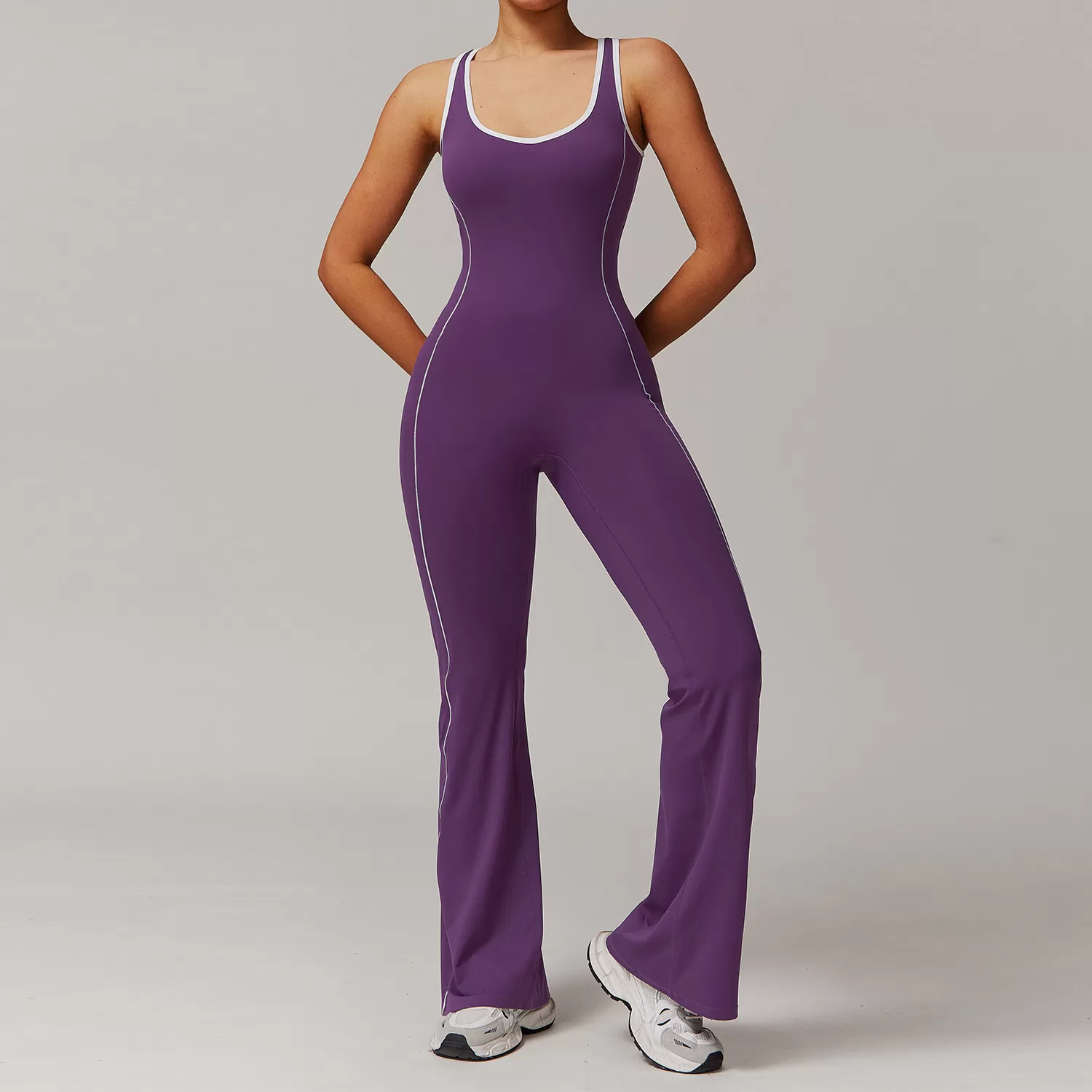 Traje de yoga ajustado al por mayor, mono de una pieza con dobladillo acampanado y control de abdomen para realce de glúteos, FGBDLT5009