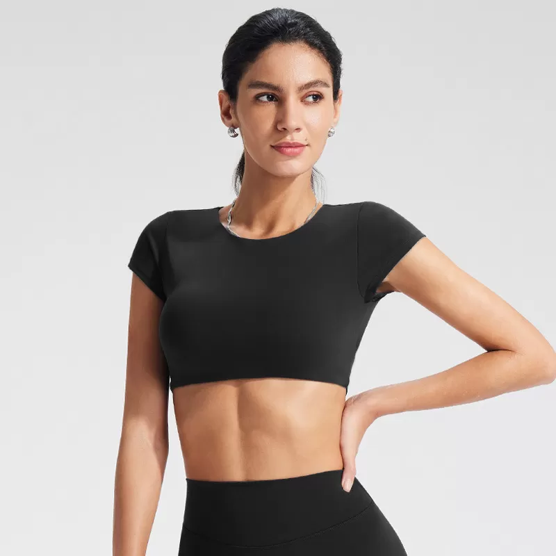 ¡Novedad! Top corto de yoga para gimnasio, entrenamiento y fitness. ¡En oferta! Top de yoga suave, sin espalda y de manga corta para mujer. Logotipo personalizado. Modelo FGBYT1341