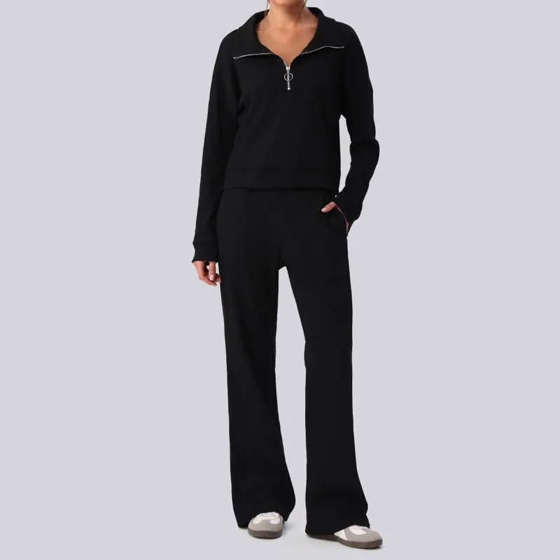 Conjunto de top de manga larga negro y pantalón