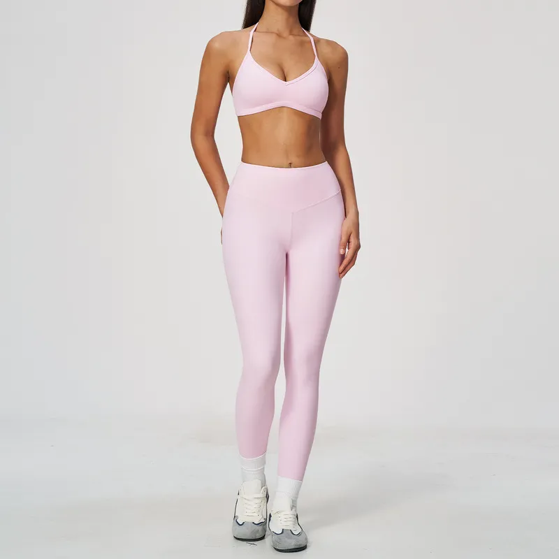 Sujetador y leggings rosa bebé